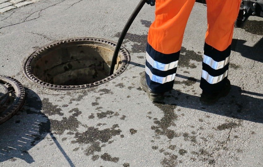 cleaning out floor drain with snake LA Wrench Plumbing San Fernando Valley