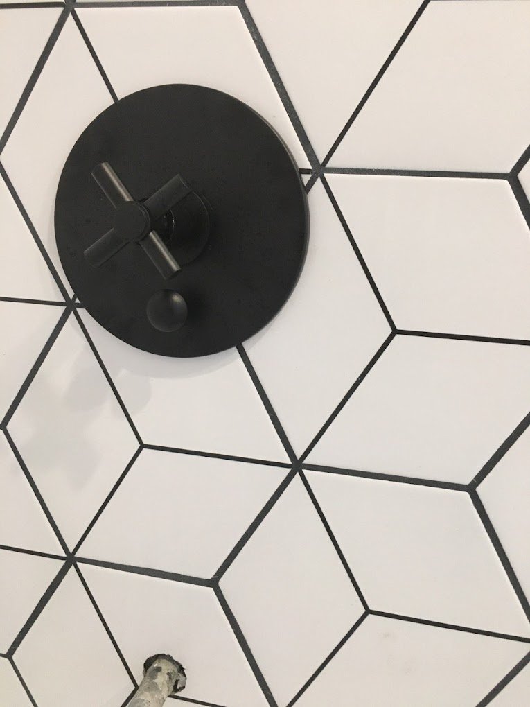 shower handle with copper pipe exposed for tub spout